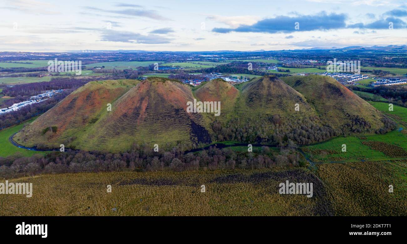 Aerial panoramic view of the Five Sisters shale bing, West Calder, West Lothian, Scotland. Stock Photo