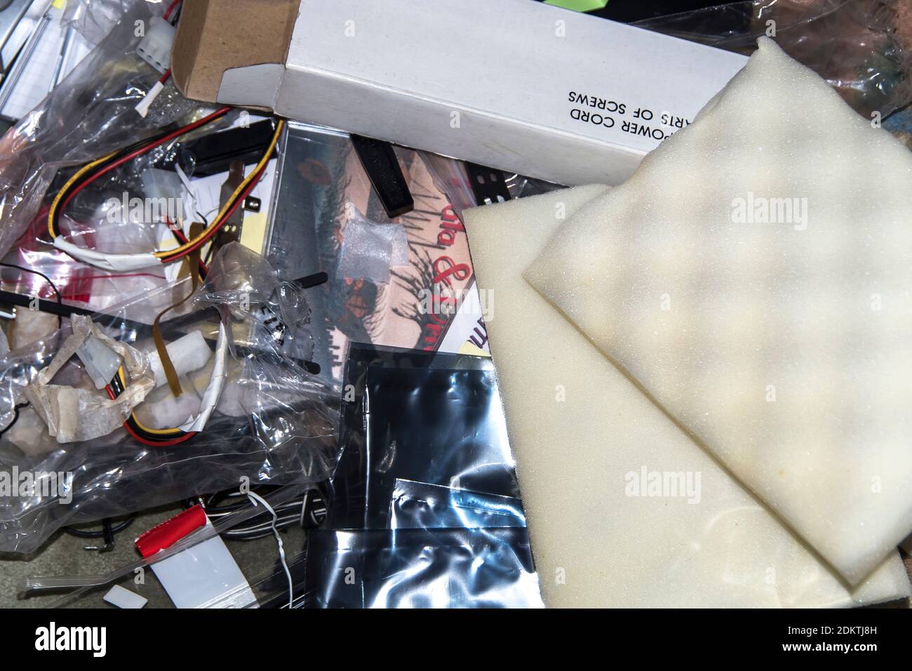 Old, obsolete computer parts and equipment about to be recycled or thrown out. Accumulation of e-waste. Stock Photo
