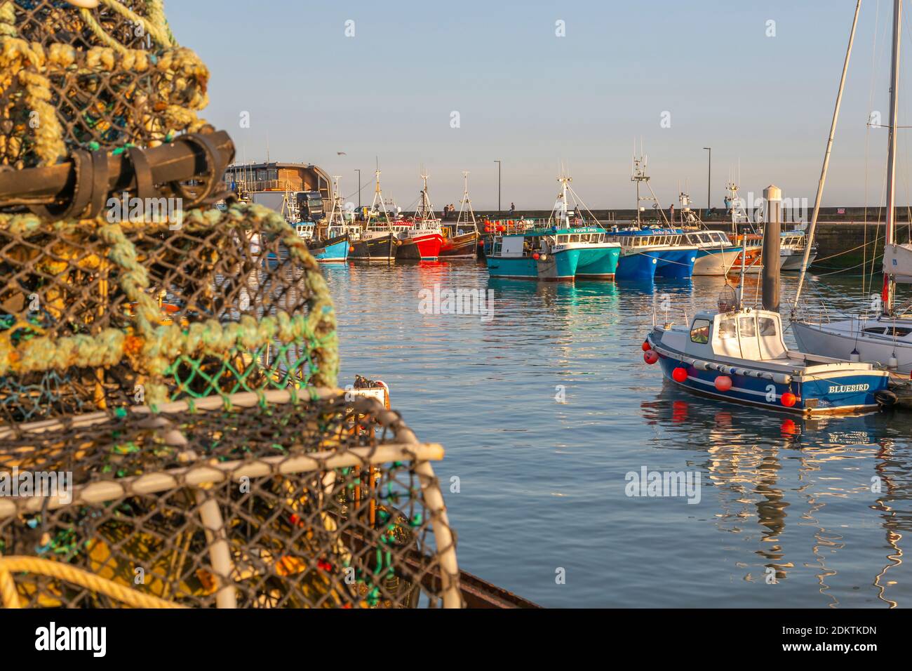 View of harbour boats and fishing baskets in Bridlington Harbour, Bridlington, East Yorkshire, England, United Kingdom, Europe Stock Photo