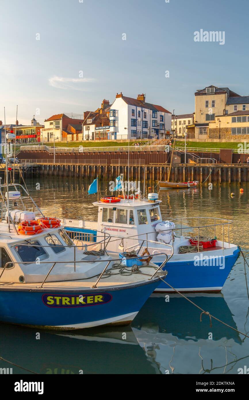 View of harbour boats and harbourside shops in Bridlington Harbour at