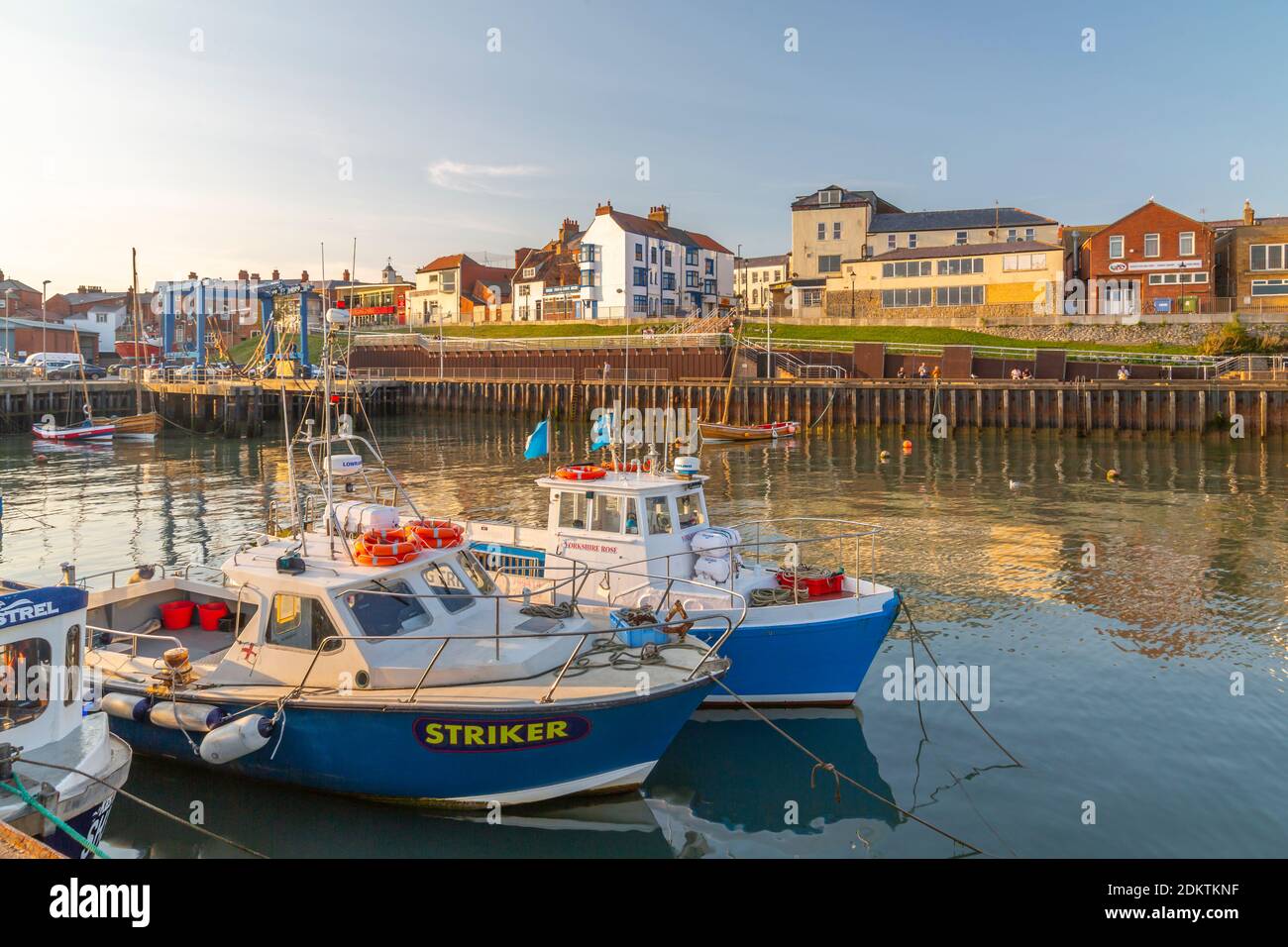 View of harbour boats and harbourside shops in Bridlington Harbour at