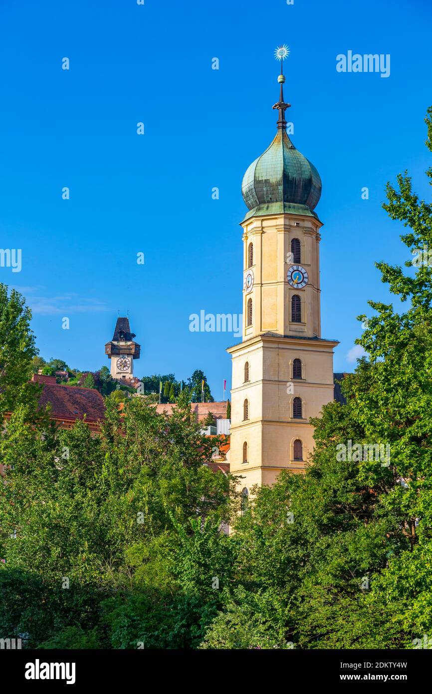 View of Franciscan Church, Clock Tower and Castle (Schlossberg) overlooking the city, Graz, Styria, Austria, Europe Stock Photo