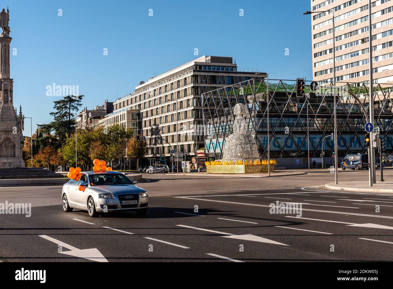 Madrid, Spain - November 22, 2020: Car carrying orange balloons in Plaza de Colon in Madrid during demonstration against Celaa Education Law Stock Photo