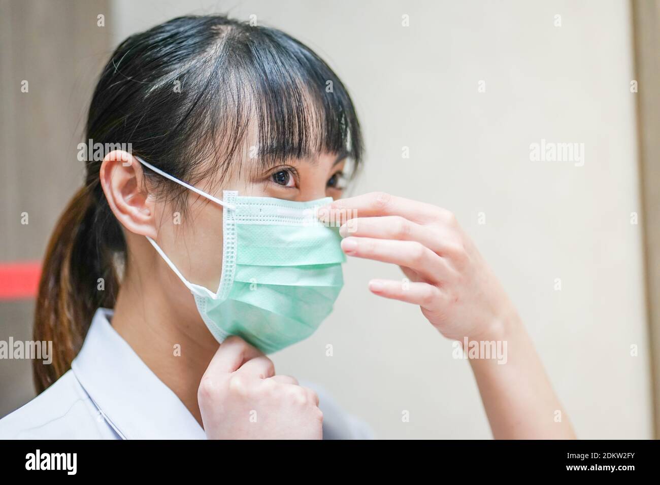 Close-up Of Female Doctor Wearing Mask Stock Photo
