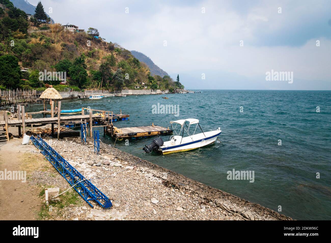 Wooden swimming dock along lake Atitlan at the coast of Santa Cruz la Laguna, Guatemala Stock Photo