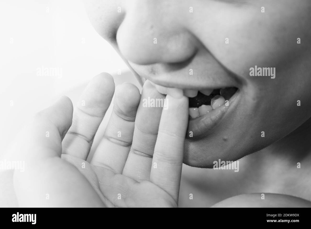Biting your finger Black and White Stock Photos & Images Alamy