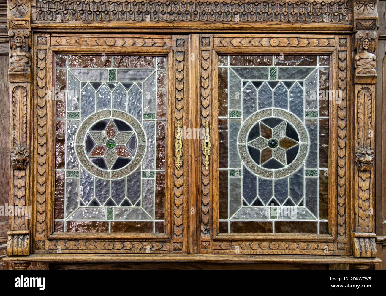 Part of an antique European glass-fronted display cabinet of the end of 19th century. Stock Photo