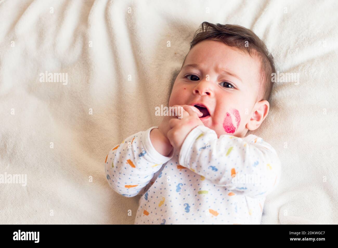 Closeup Of Baby With Lipstick Mark Stock Photo Alamy