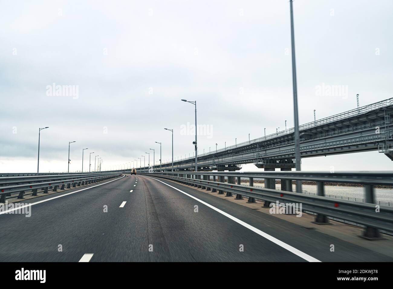 Empty highway with asphalt road and cloudy sky Stock Photo - Alamy