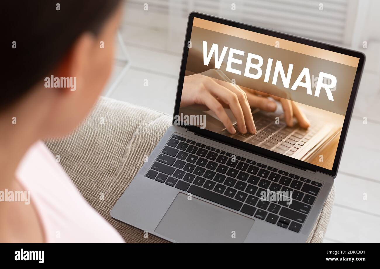 Unrecognizable Woman Looking At Laptop Webinar Screen Saver, Home Interior Stock Photo