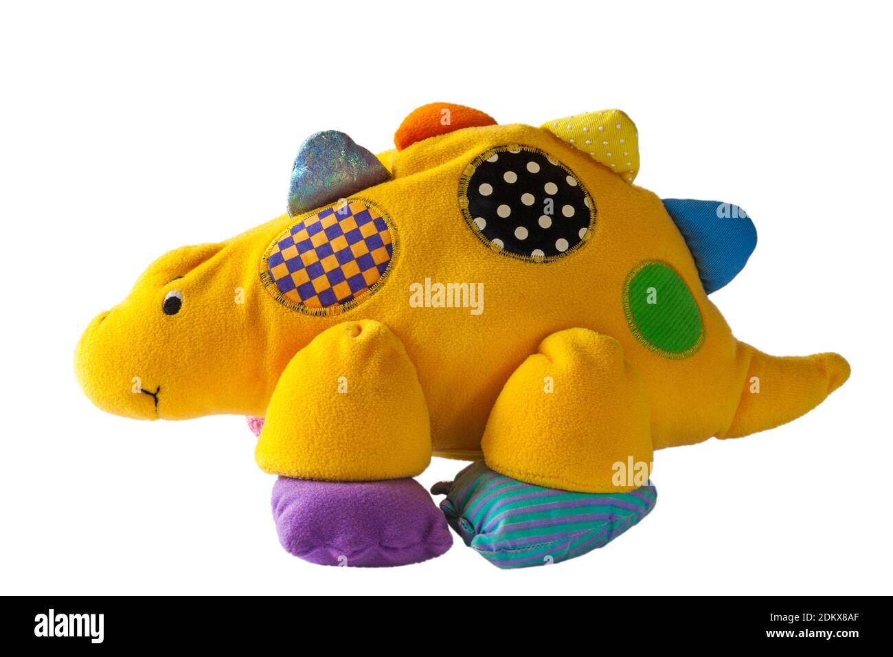 yellow stuffed dinosaur