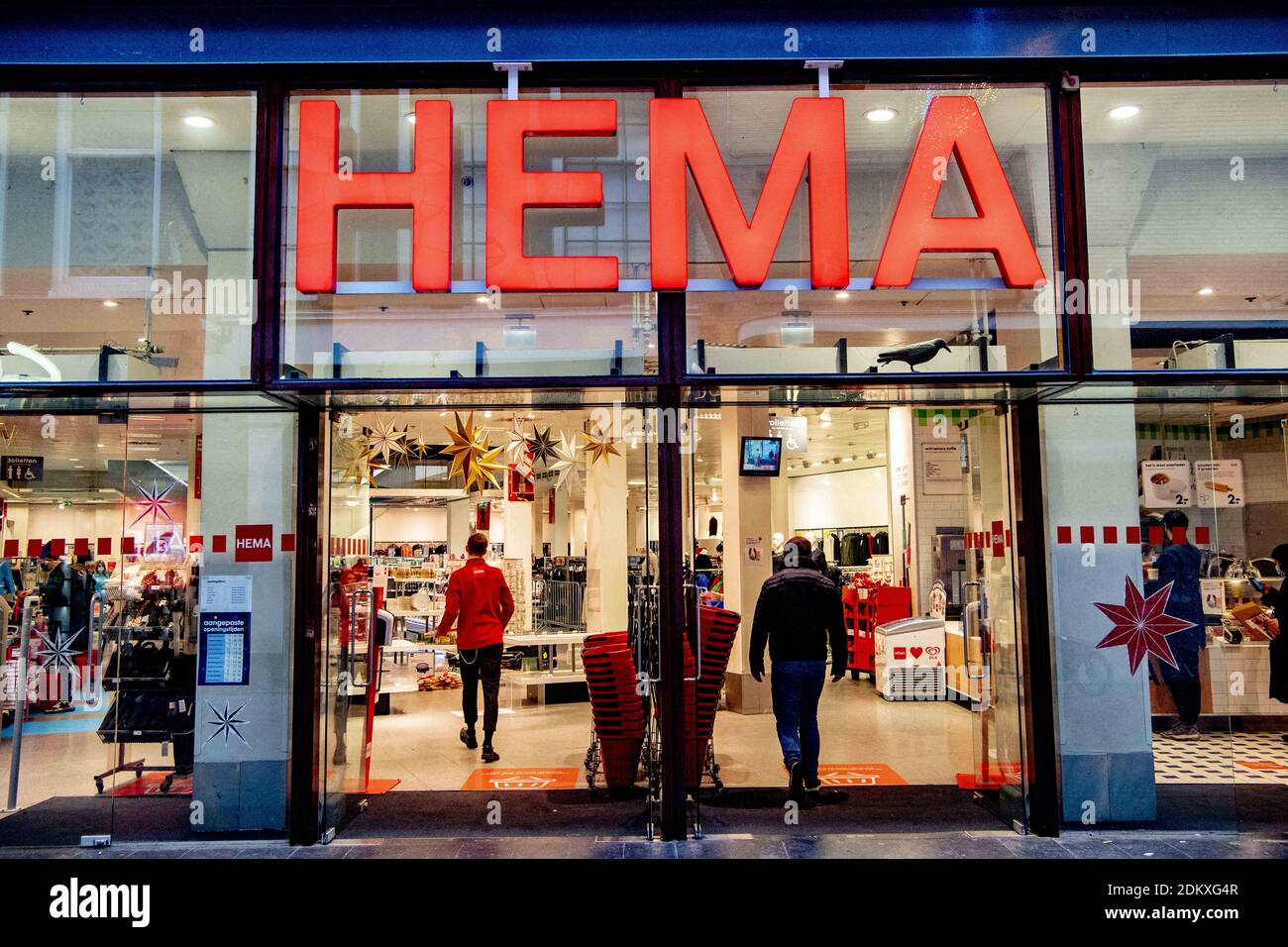shoppers are seen in A Hema supermarket December 16, 2020 in Rotterdam. Hema has declared itself the Netherlands' biggest bakery and is also open for business but has roped off