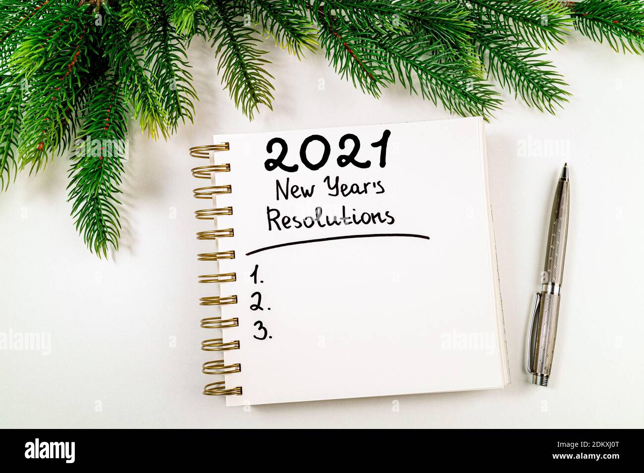 New year resolutions 2021 on desk. 2021 goals with open notebook