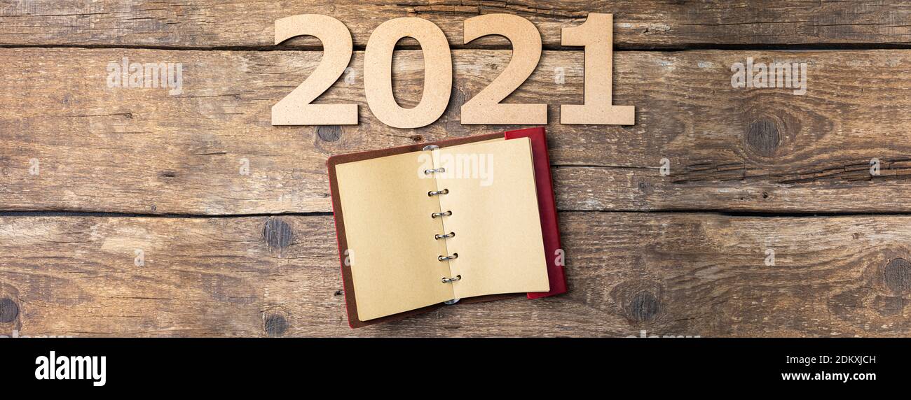 New year resolutions 2021 on desk. 2021 resolutions with open notebook ...