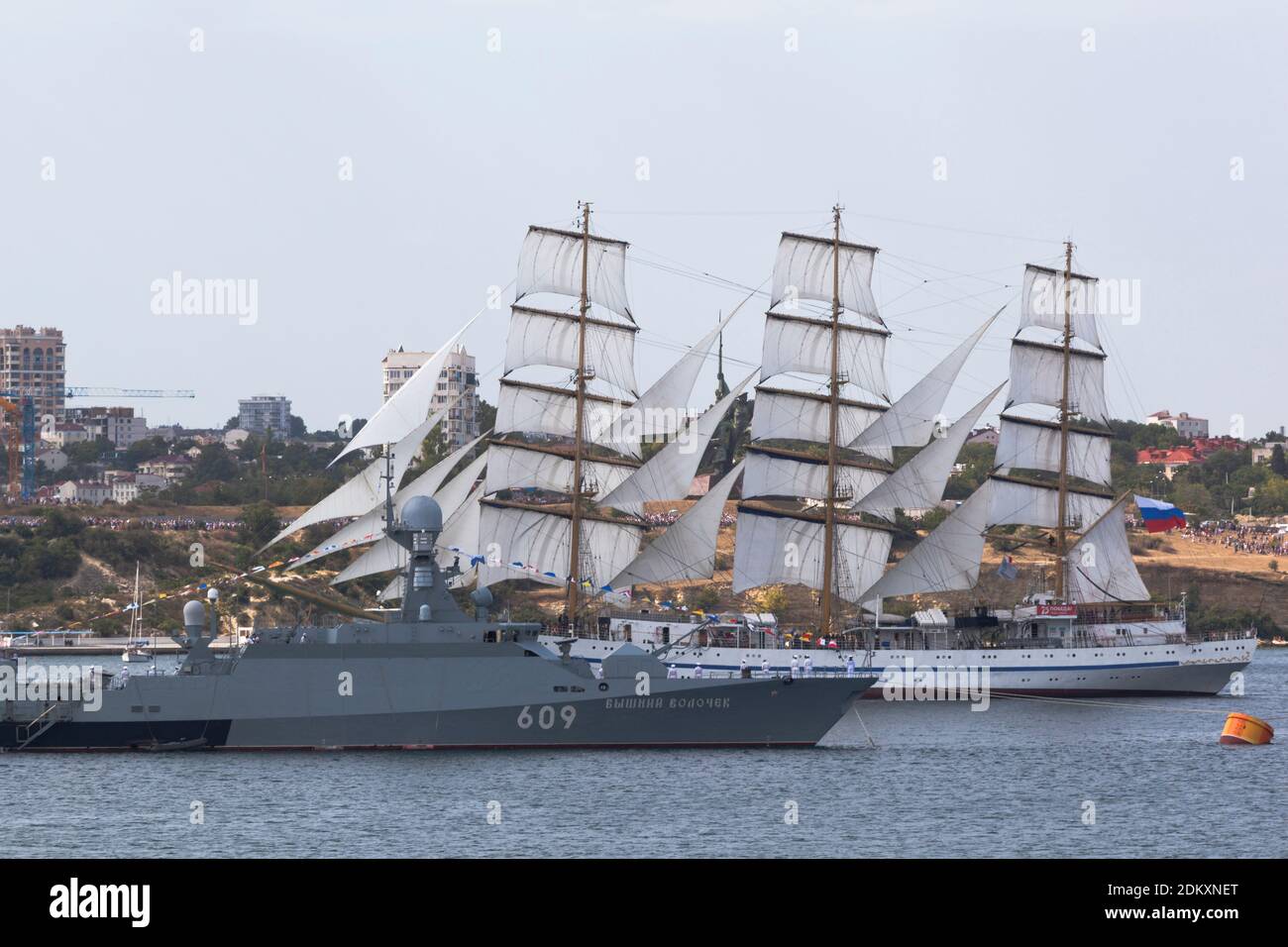 Sevastopol, Crimea, Russia - July 26, 2020: Sailboat Chersonesos passes next to the small missile ship Vyshny Volochek at the parade in honor of the N Stock Photo