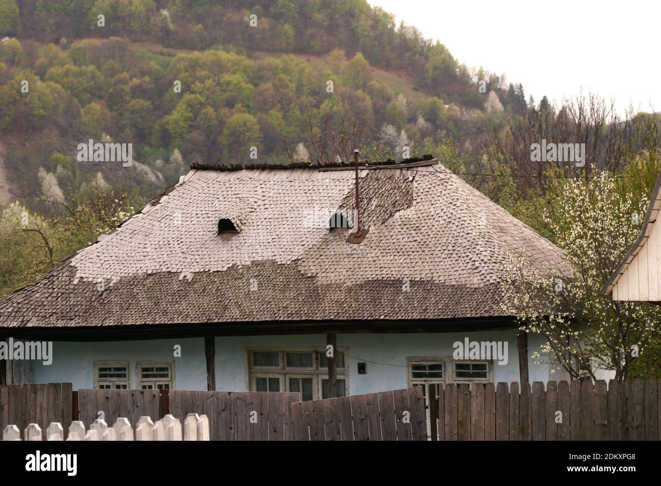 Vrancea County, Romania. Old house built in the traditional style, with wood shingle roof. Stock Photo