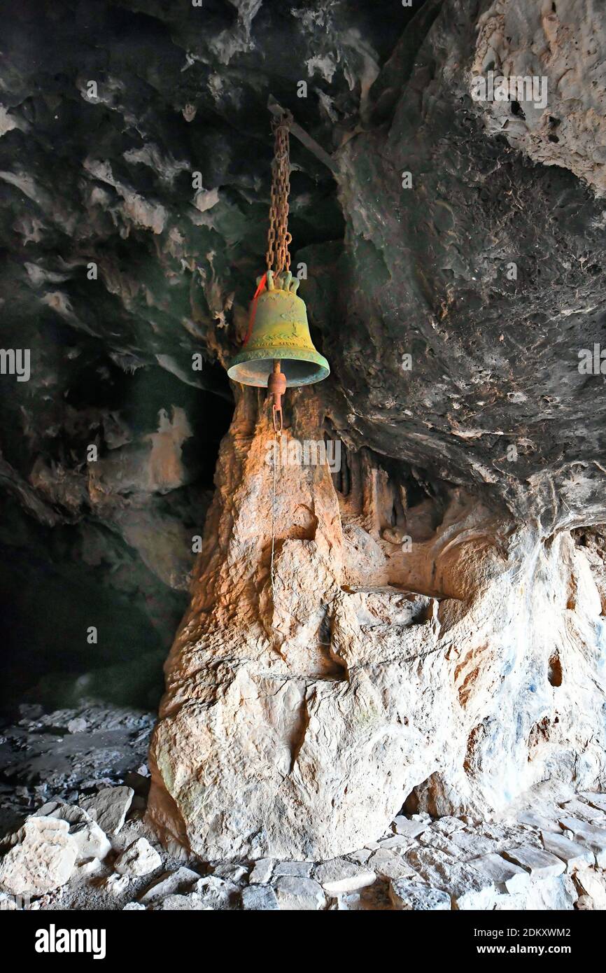 Greece, Crete Island, bell of the tiny chapel in Arkoudiotississa cave aka Arkoudospilios cave or Bear Cave Stock Photo
