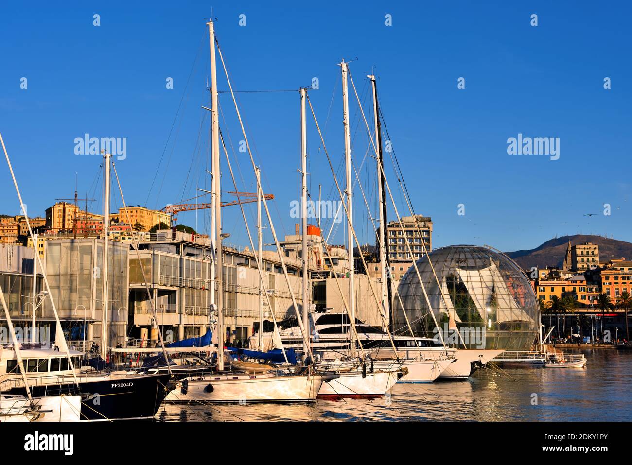 aquarium, bubble (renzo piano biosphere) and panorama of the port and the city skyscrapers December 13 2020 Genoa Italy Stock Photo