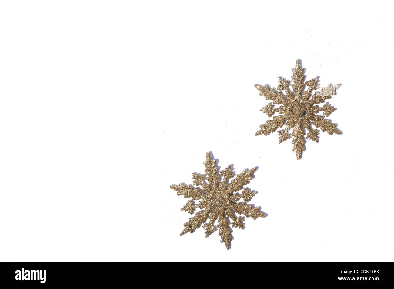 Gold glitter texture snowflakes isolated on white background. Abstract ...