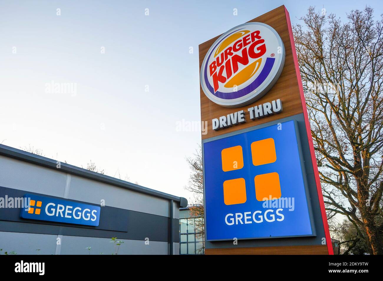 Outdoor sign of a Burger King, Greggs drive thru, UK. Stock Photo
