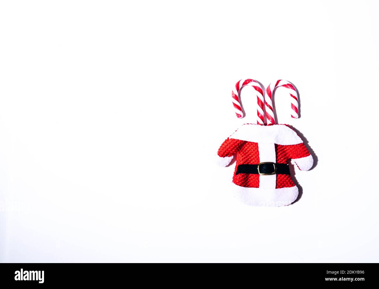 Christmas candy canes on white background. Minimalist christmas background. Stock Photo