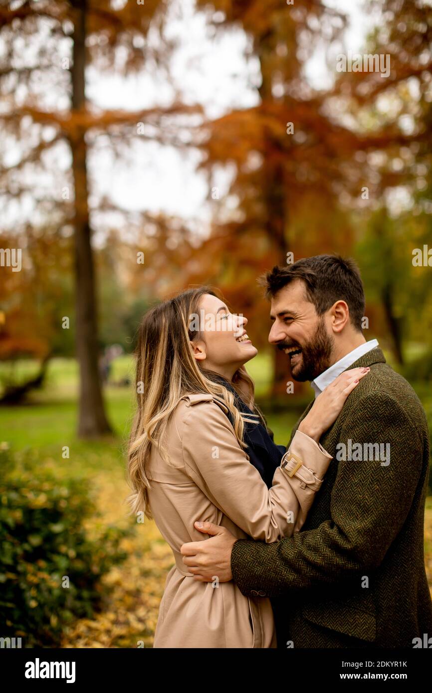 Handsome young couple in the autumn park Stock Photo - Alamy