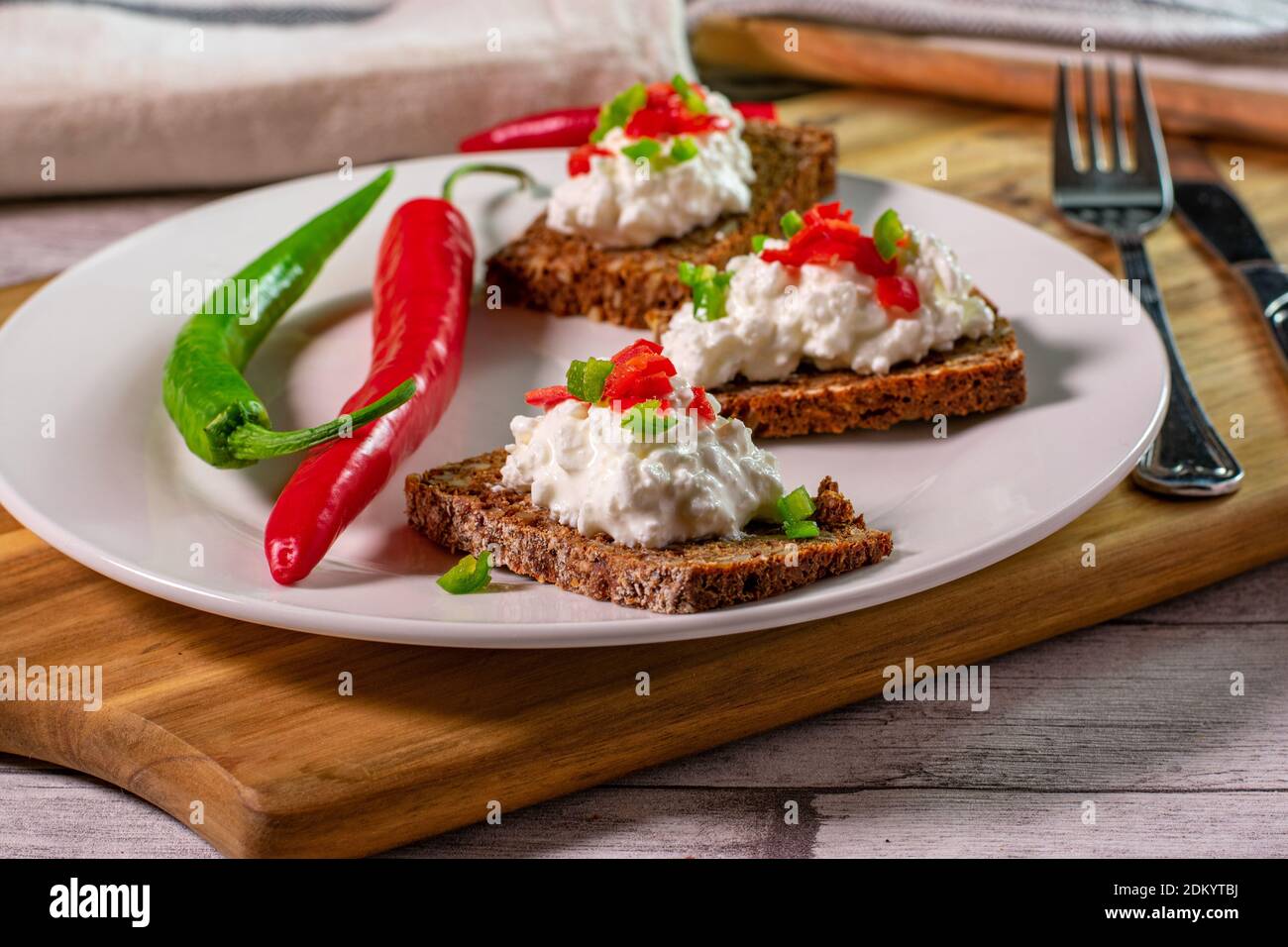 open sandwich with cottage cheese and pepperoni served on a plate Stock Photo