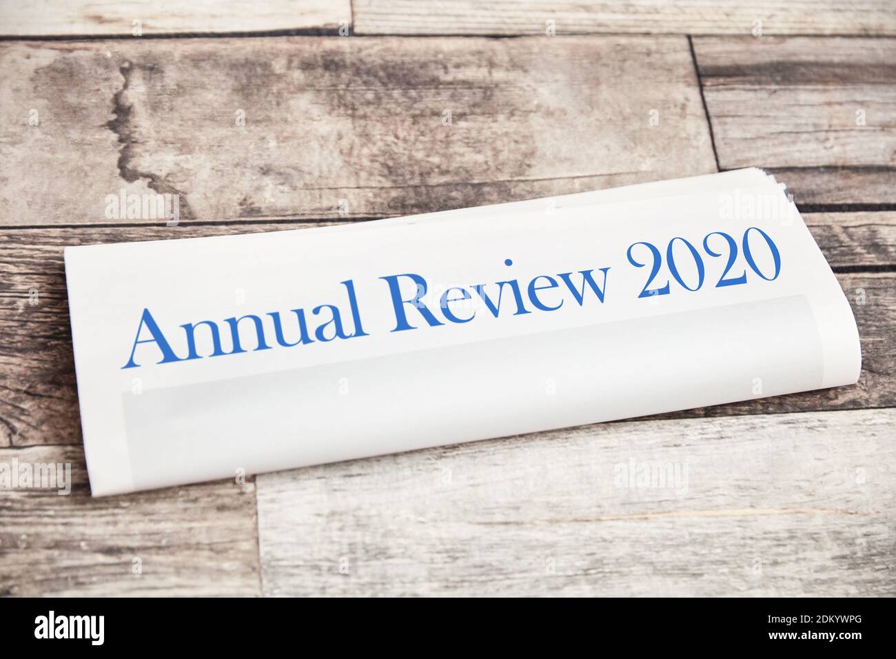 Annual Review 2020 on a folded newspaper as the front page Stock Photo
