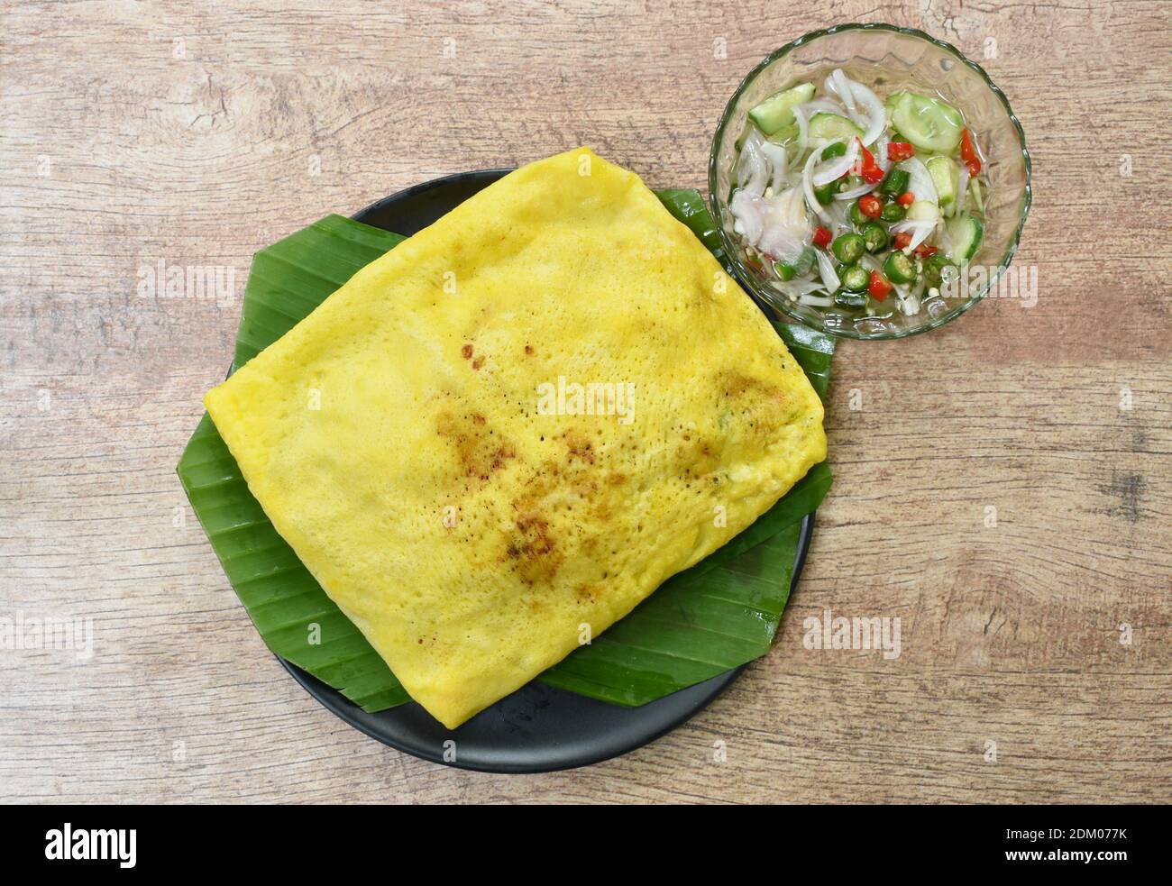 Vietnamese omelette stuffed fried bean sprout and tofu on plate dipping