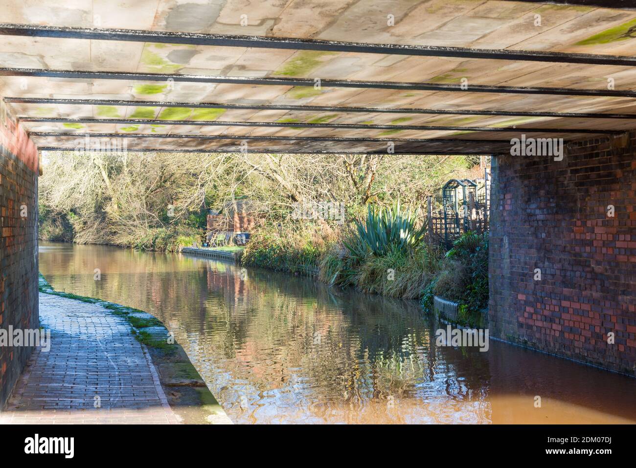 The Worcester and Birmingham canal passes under a modern road bridge in