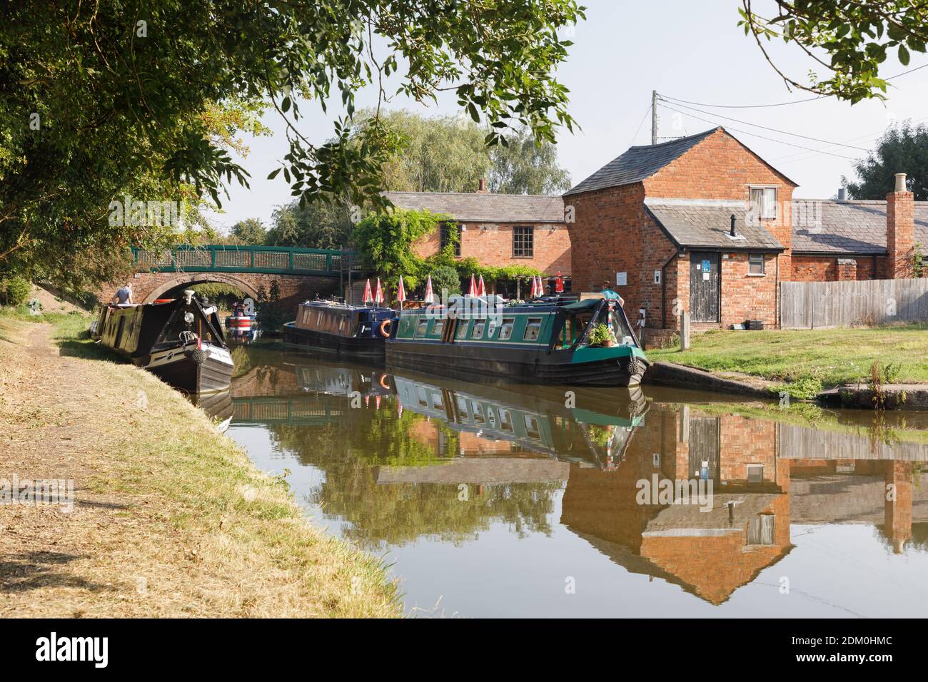 Crick, Northamptonshire, UK - 13/08/20: Narrowboats moored at Crick Wharf on the Grand union canal, a popular location for boating holidays. Stock Photo