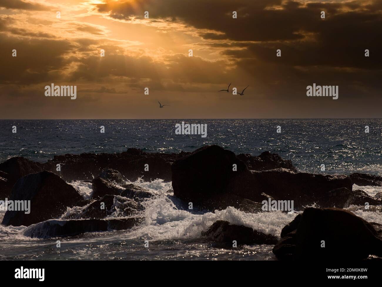 Sun Setting over the Sea of Cortez in Cabo San Lucas, Mexico Stock Photo
