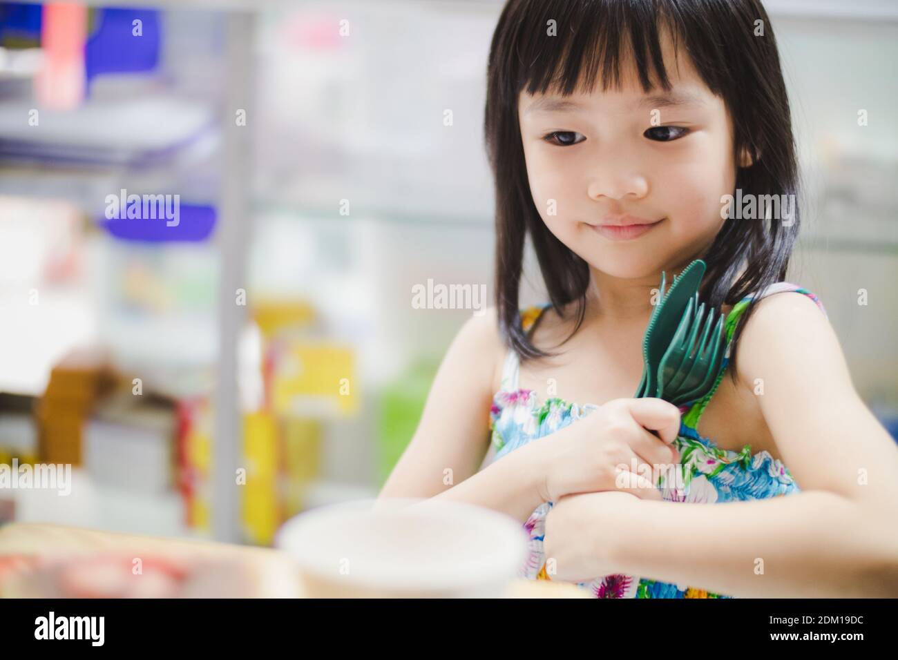 Cute Girl Holding Forks And Spoon Stock Photo Alamy