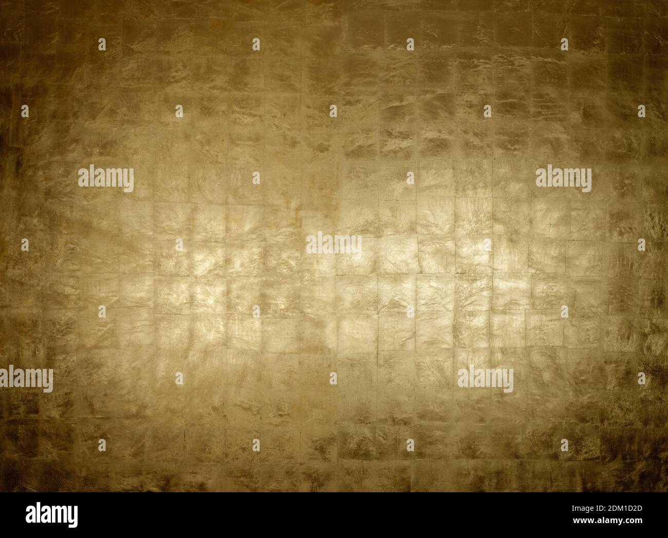 Luxurious burnished gold leaf surface on background panel Stock Photo