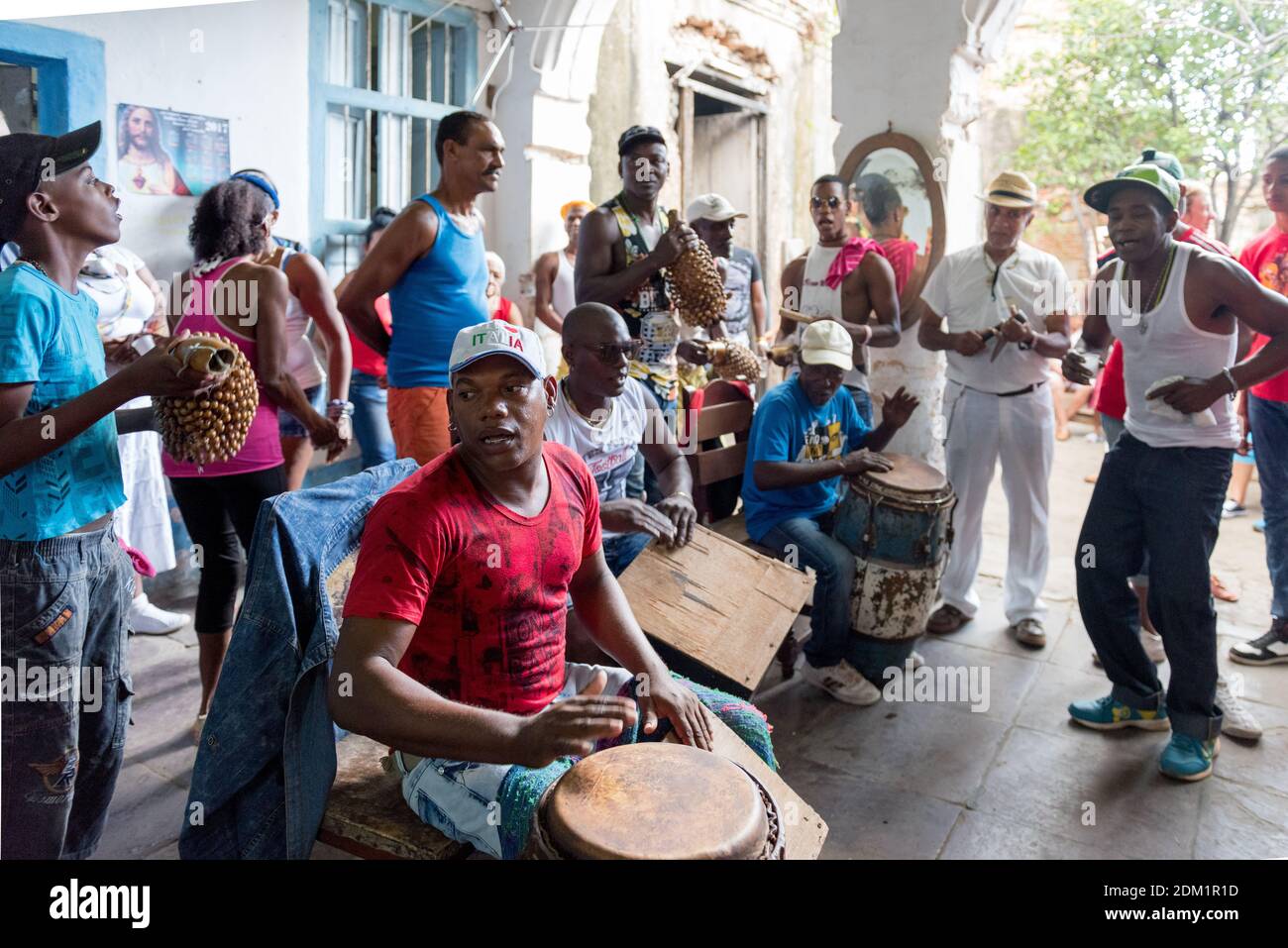 Santeria religion followers drumming and making music in Trinidad, Cuba Stock Photo