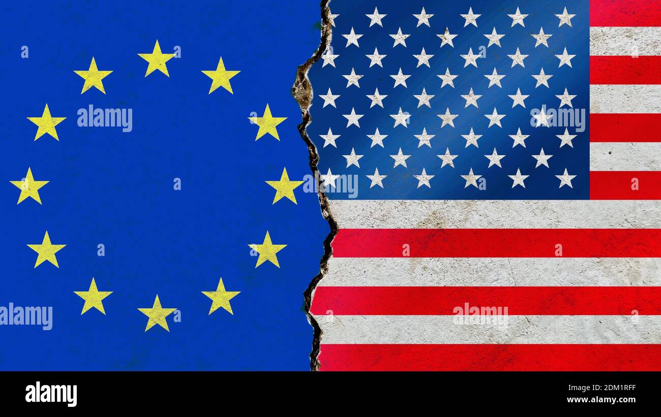 An American and EU flag on a cracked wall-politics, war, conflict concept Stock Photo