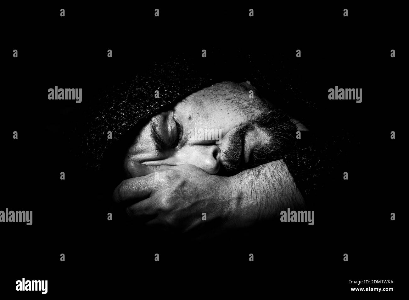 Close-up Of Sad Man Sleeping Against Black Background Stock Photo - Alamy