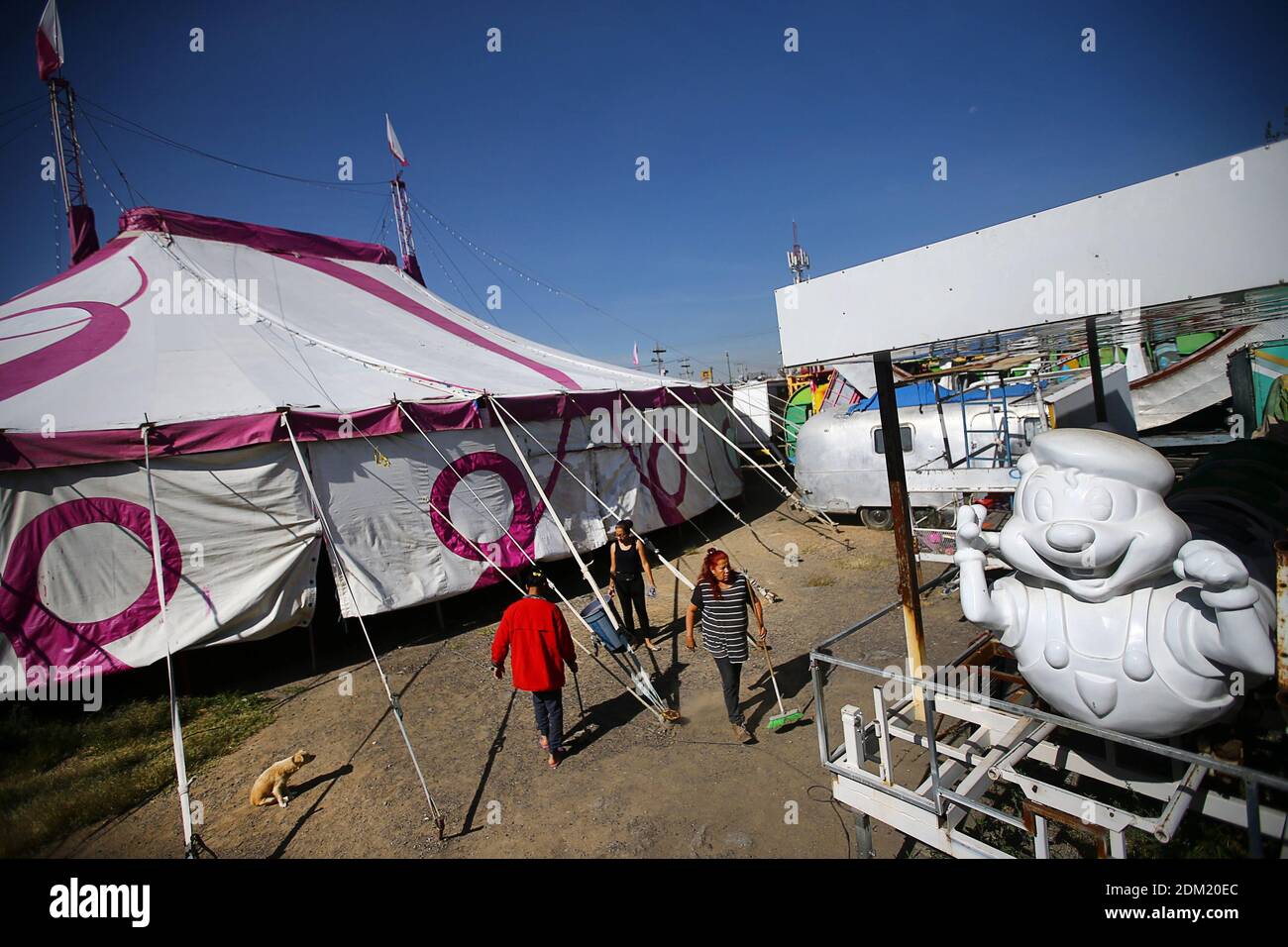 Circus artists clean outside a tent of the family-owned Glez Family Circus which has remained under lockdown since March due to a high coronavirus disease (COVID-19) infection rate, in Mexico City, Mexico October 7, 2020. Picture taken October 7, 2020. REUTERS/Edgard Garrido Stock Photo