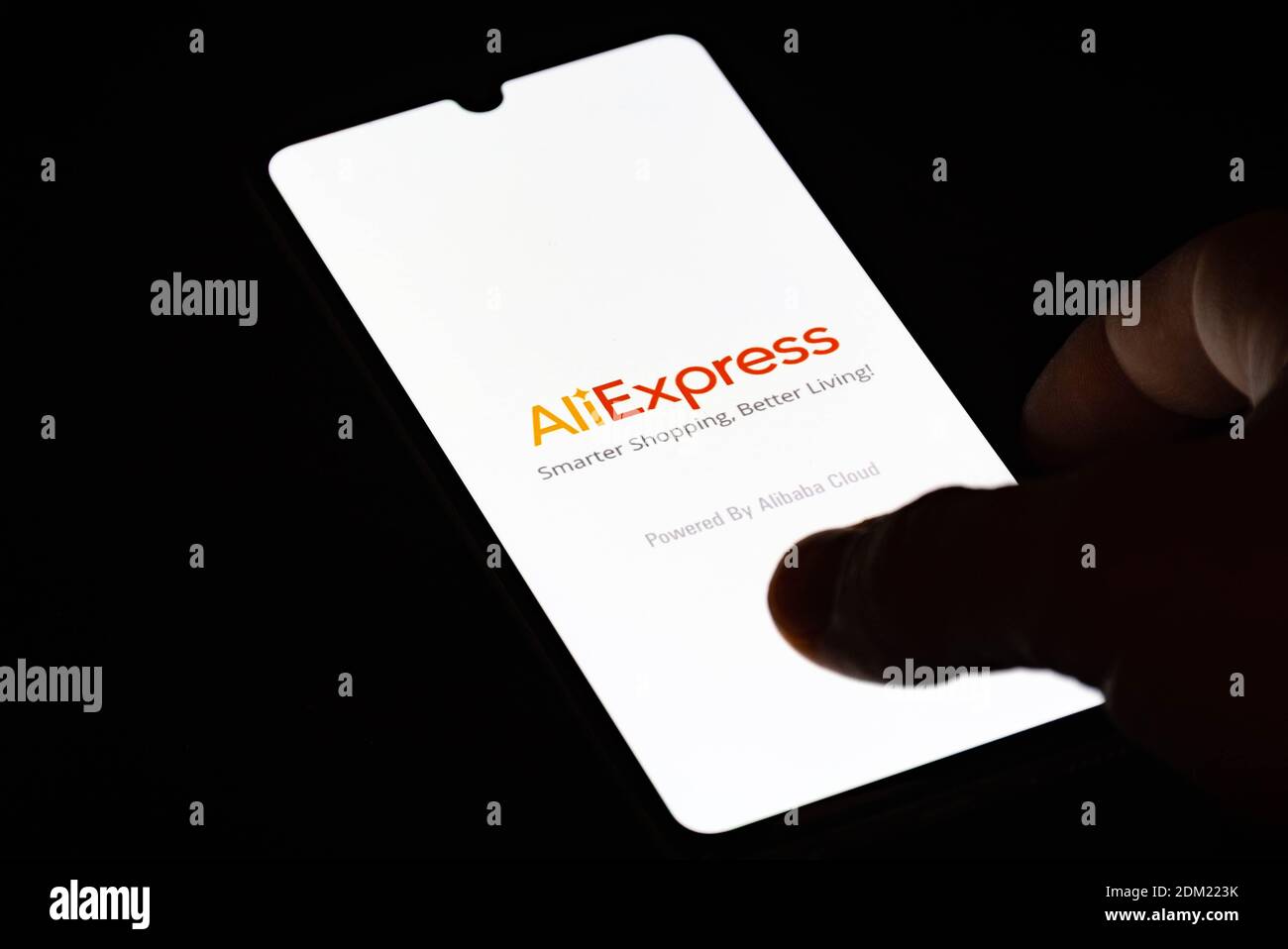 AliExpress app on the smartphone, shopping on line, online retail service based in China owned by the Alibaba Group with finger Stock Photo