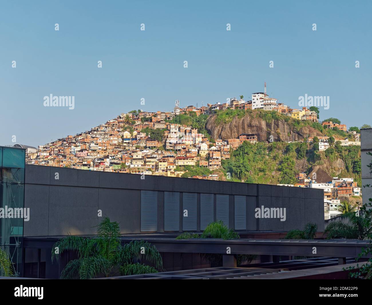 One of the many Favelas sprawling up a hill overlooking the Old Port of Rio de Janeiro, in the Porto Atlantico area downtown. Stock Photo