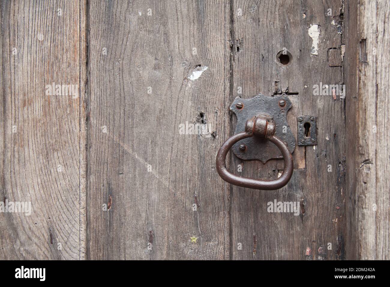Cast Iron door handle and lock in ancient wooden door Stock Photo Alamy