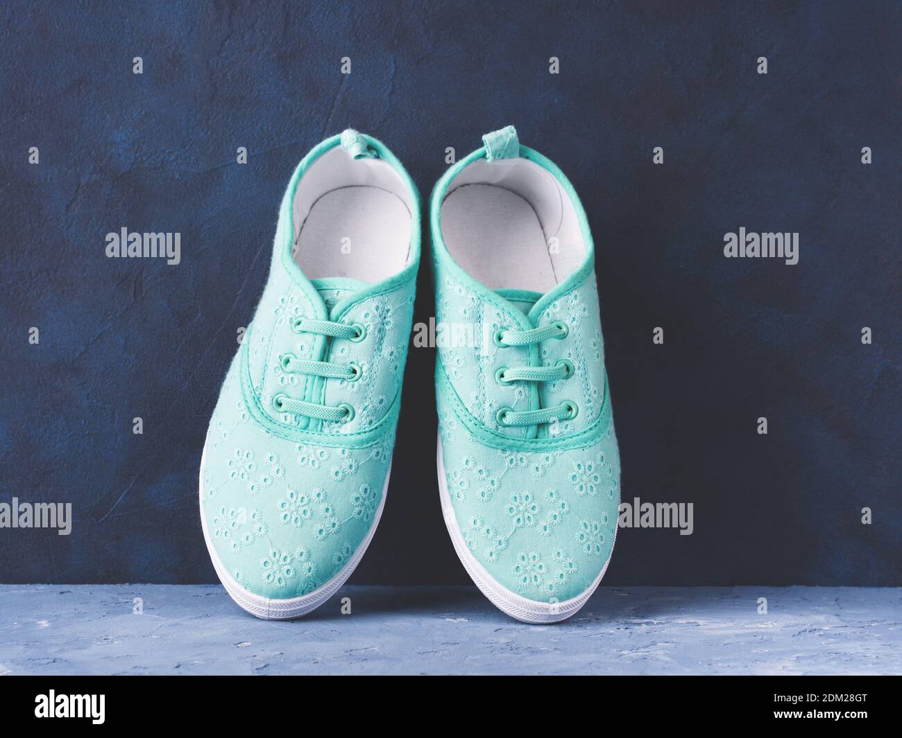 Shoes On Table Against Wall Stock Photo Alamy