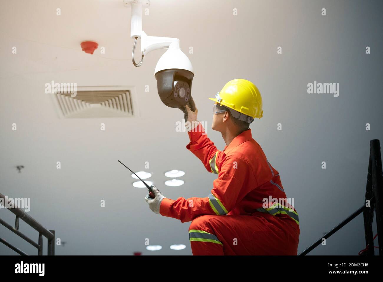 Electrician Installing Security Camera Stock Photo Alamy