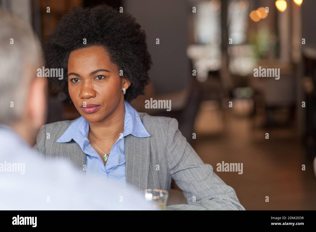 Two women talking serious cafe hi-res stock photography and images - Alamy