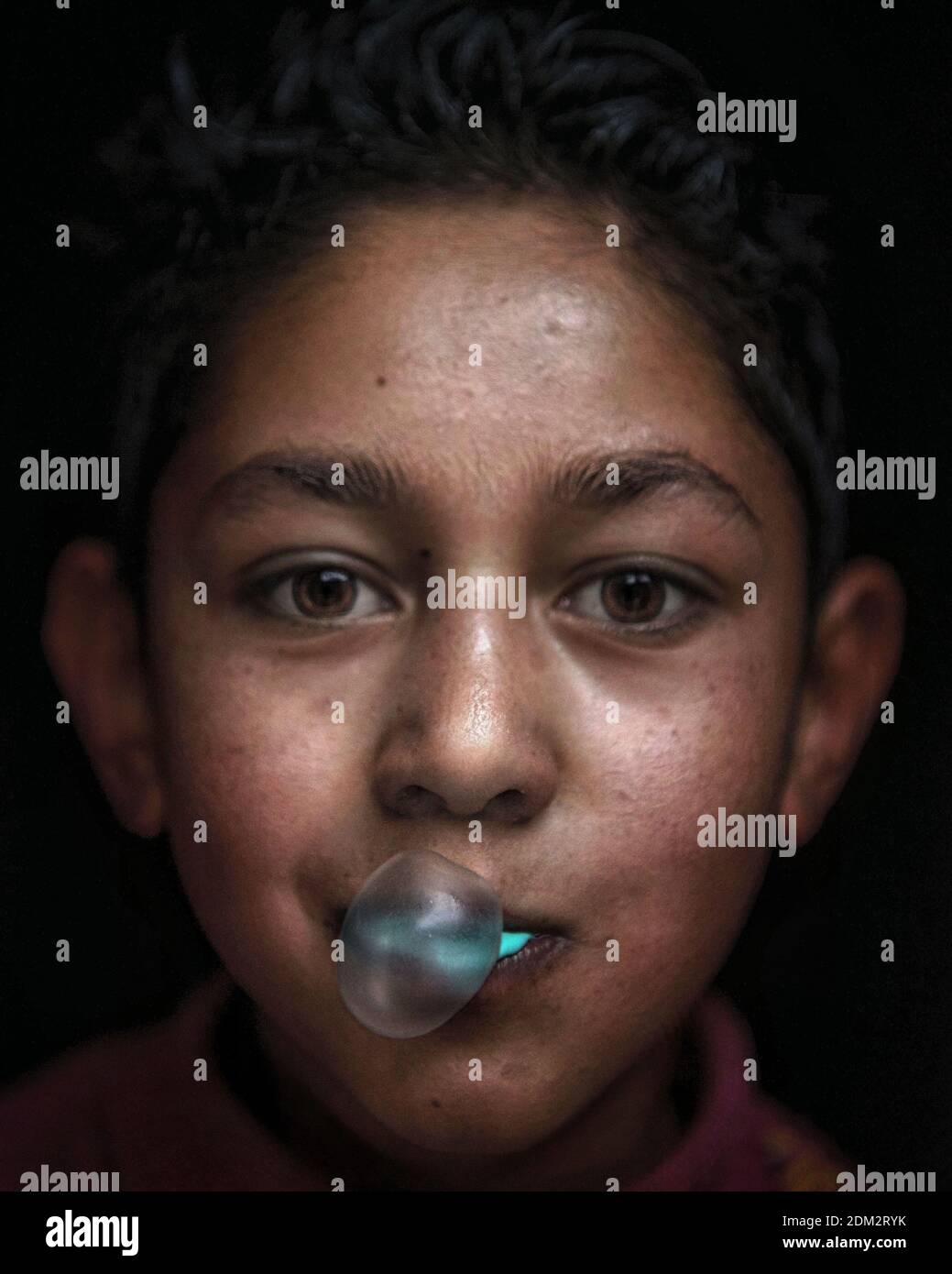 Closeup Portrait Of Man Eating Bubble Gum In Dark Room Stock Photo Alamy