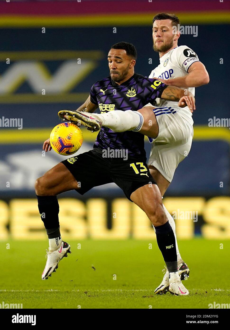 Newcastle United's Callum Wilson (left) and Leeds United's Liam Cooper ...
