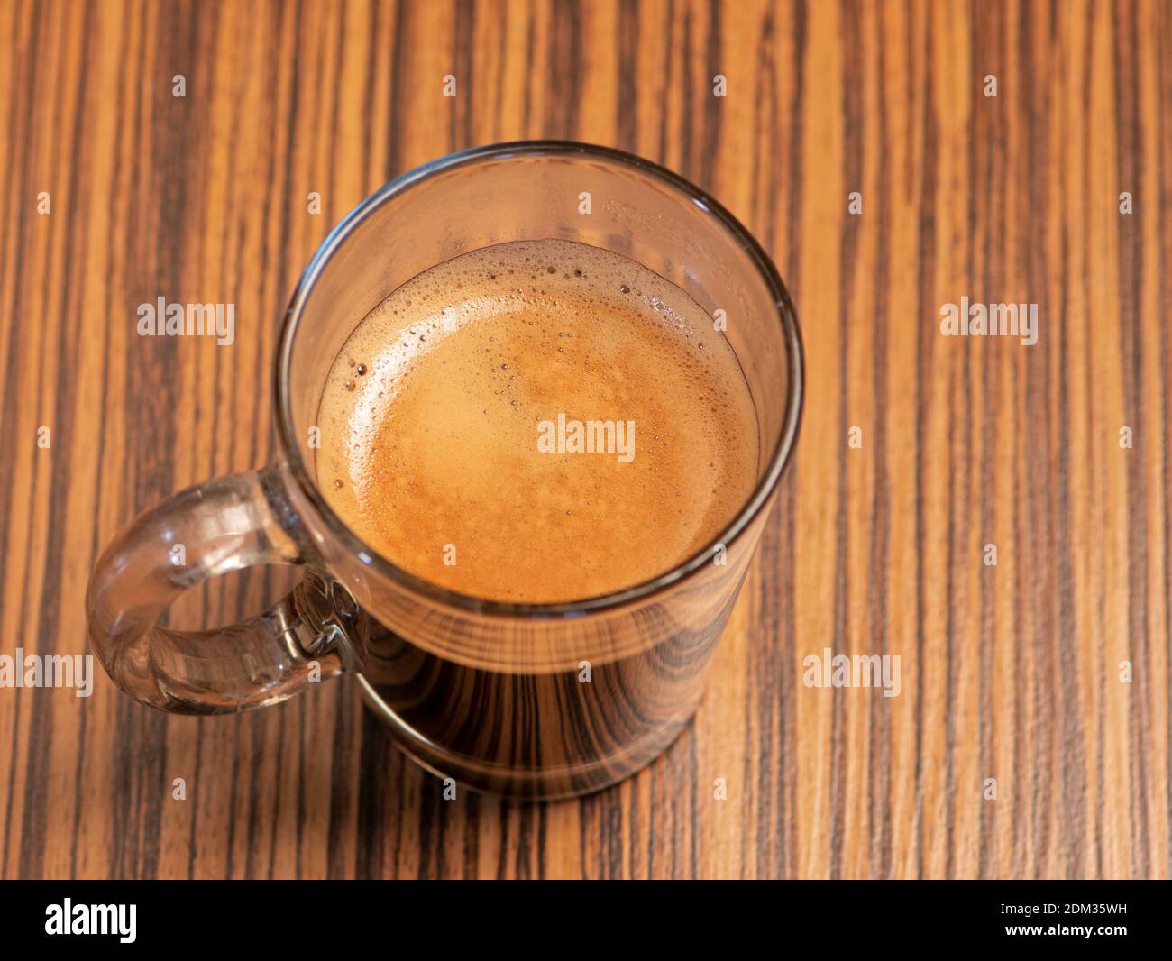 Cup of espresso isolated on wooden background Stock Photo