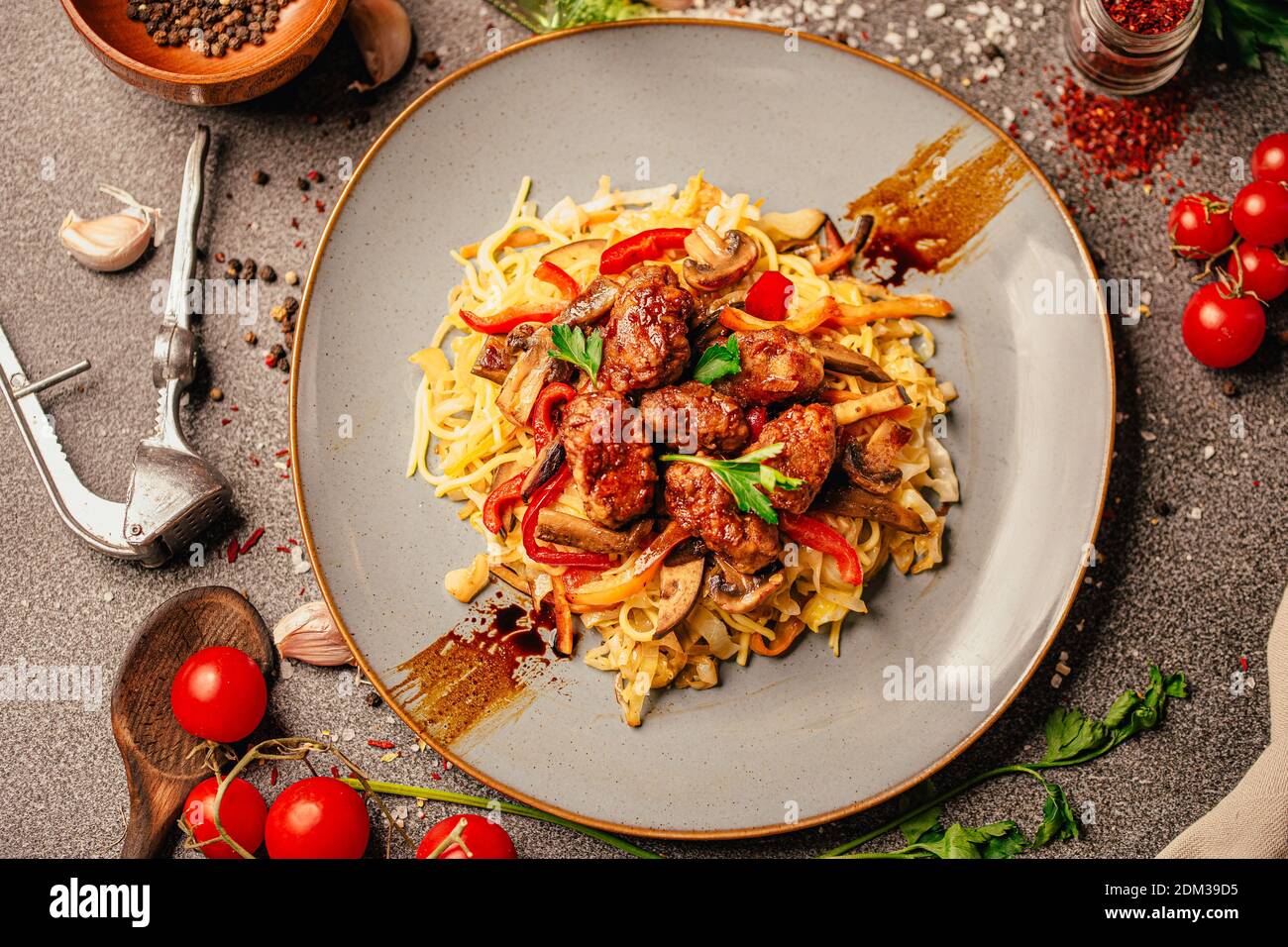 Asian style colorful vegetable and meat stir fry with noodles in spicy