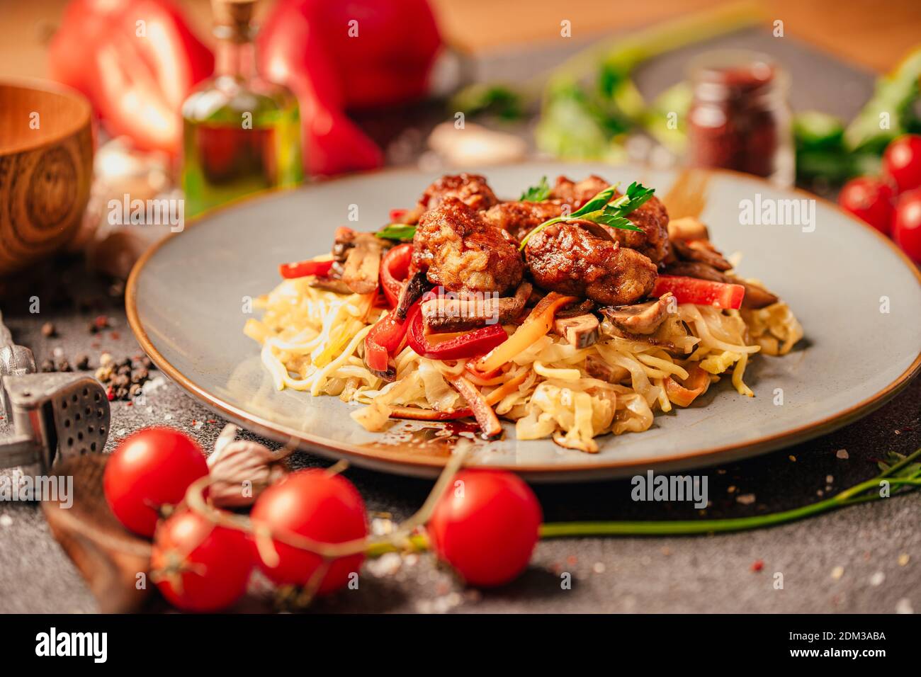 Asian style colorful vegetable and meat stir fry with noodles in spicy