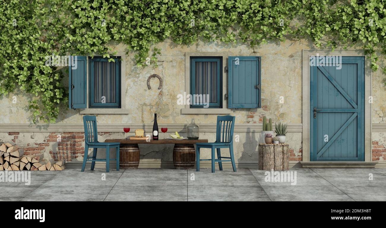 Courtyard of an old country house with chairs and food on a wooden bench - 3d rendering Stock Photo